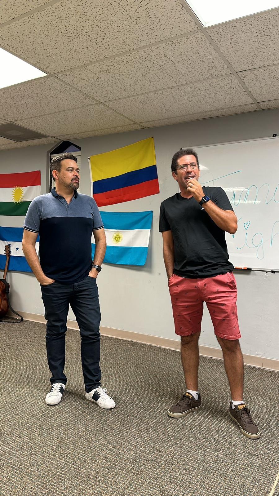 Two men talking together in a room