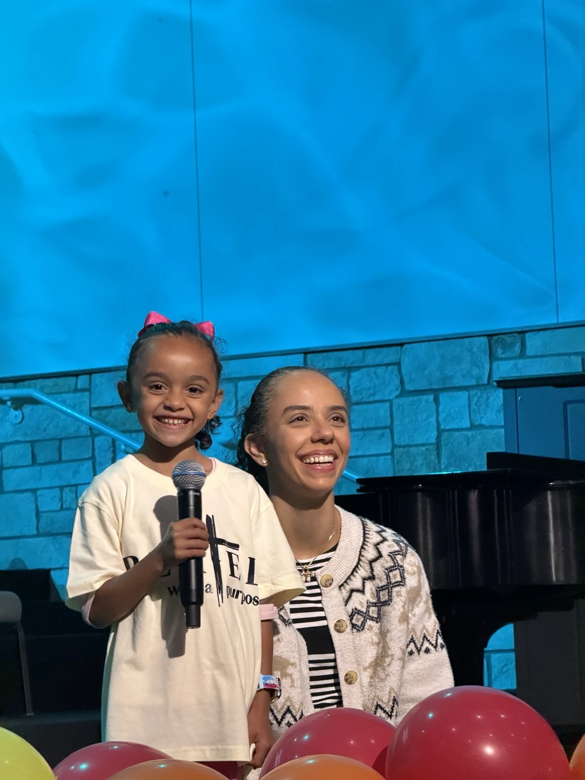A child and a woman taking part in a church activity